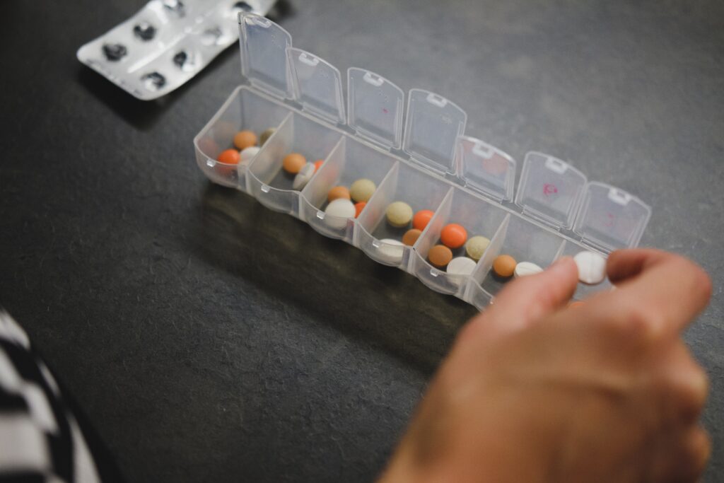 A plastic container with pills in it.